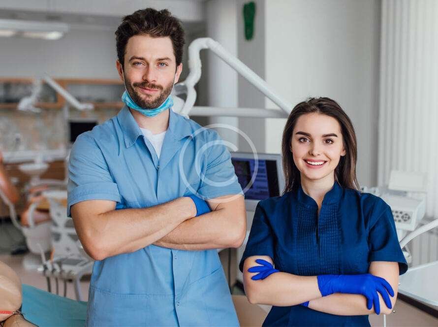 Male and female medical professionals posing together