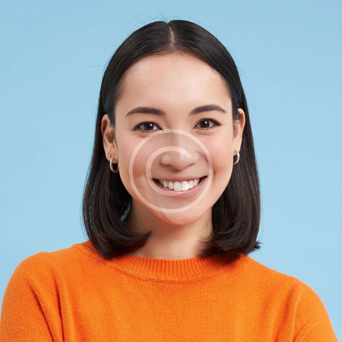Smiling female with orange shirt