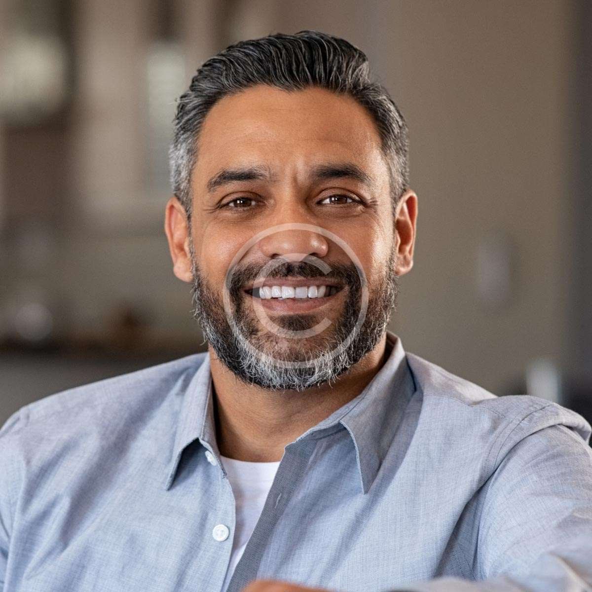 Man wearing a gray shirt