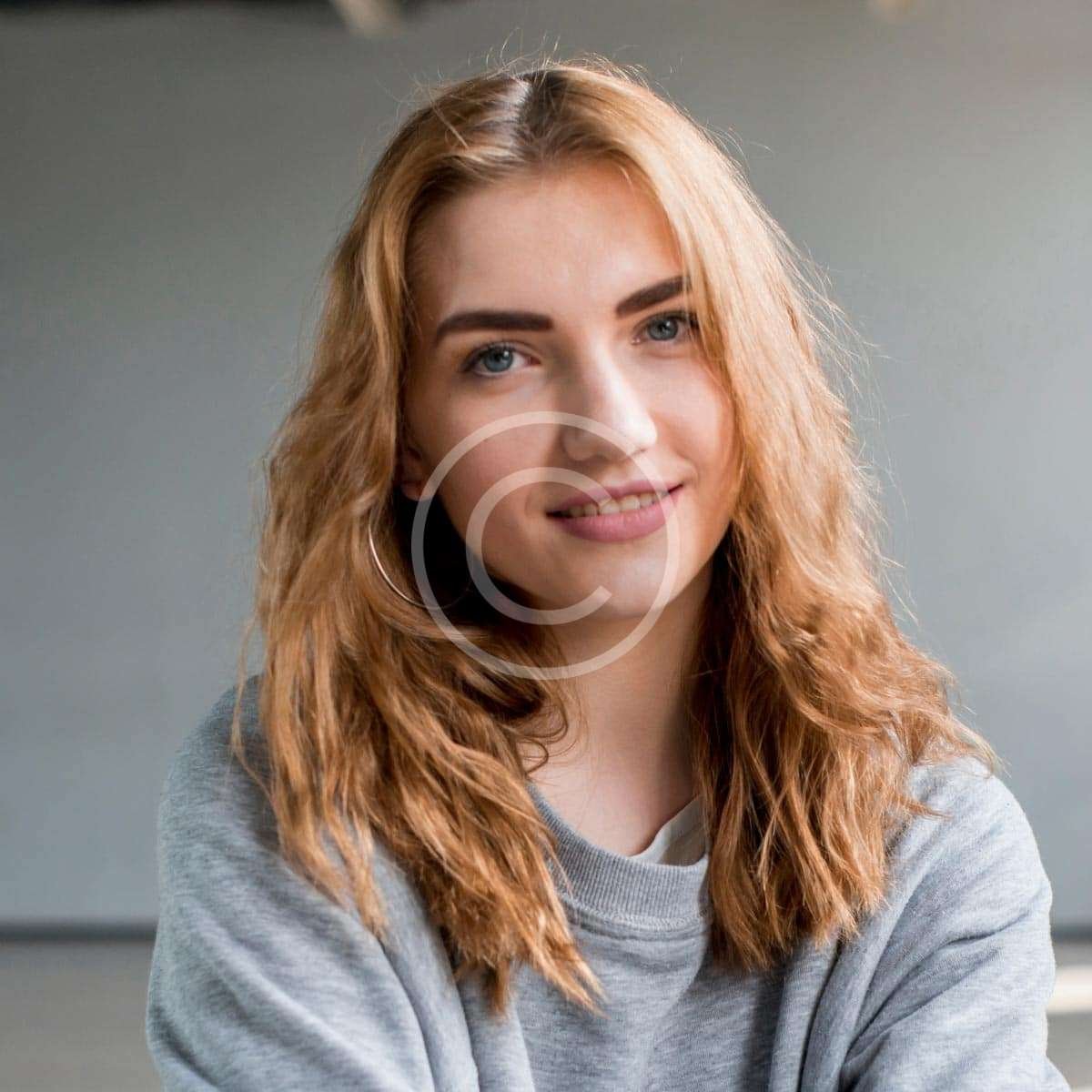 Red-haired female smiling