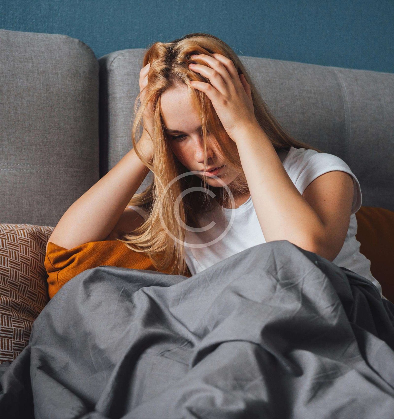 Woman covering her head with her hands