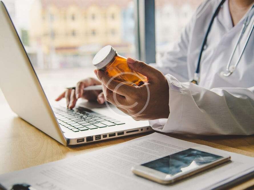 medical professional holding an empty bottle