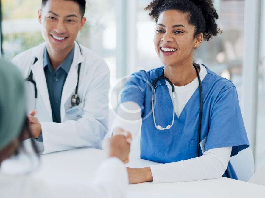 Doctors and nurses happily discussing