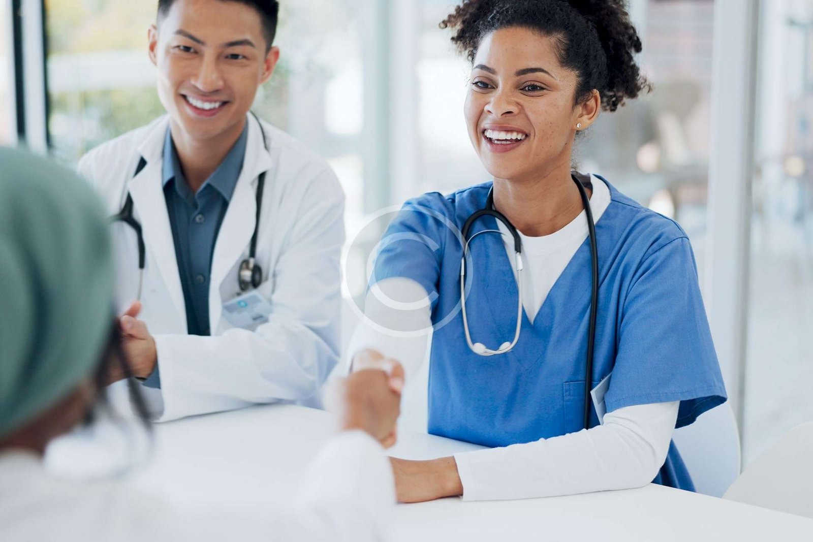 Doctors and nurses happily discussing