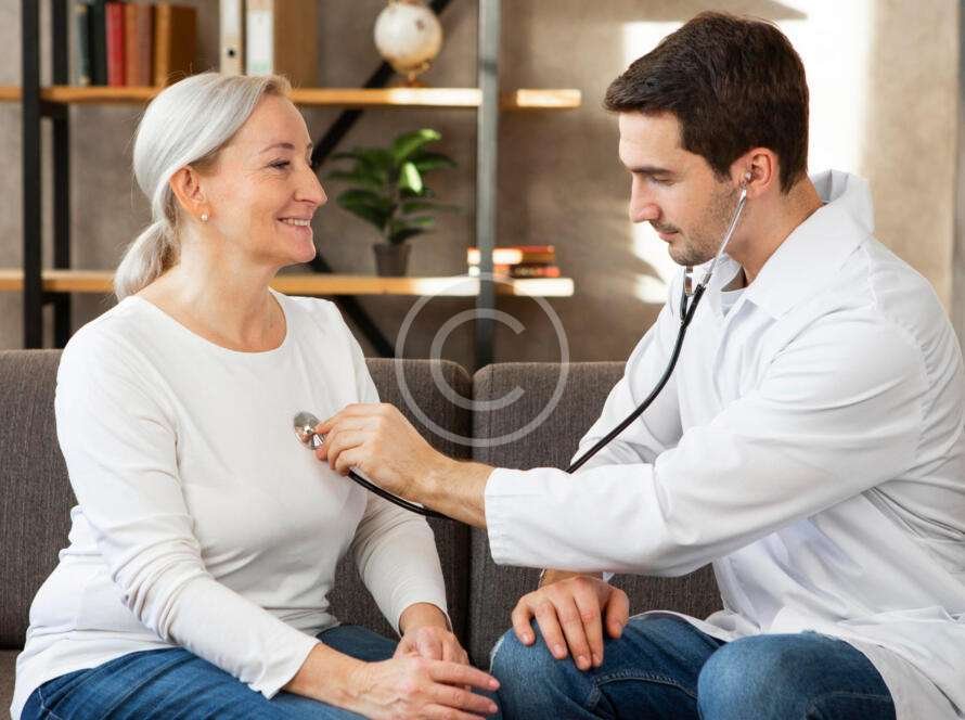 Doctor using a stethoscope on a patient