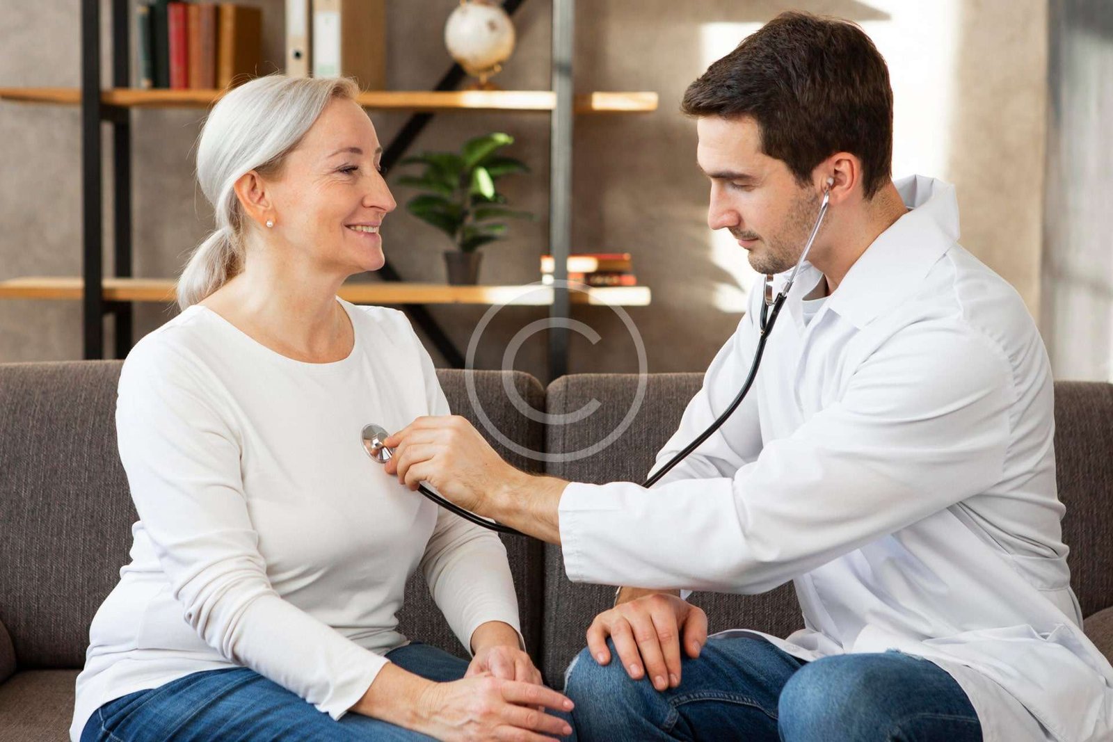 Doctor using a stethoscope on a patient