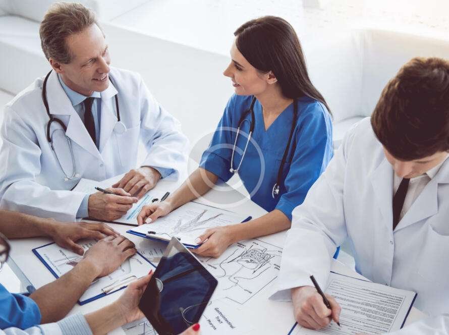 Medical professionals discussing and working together