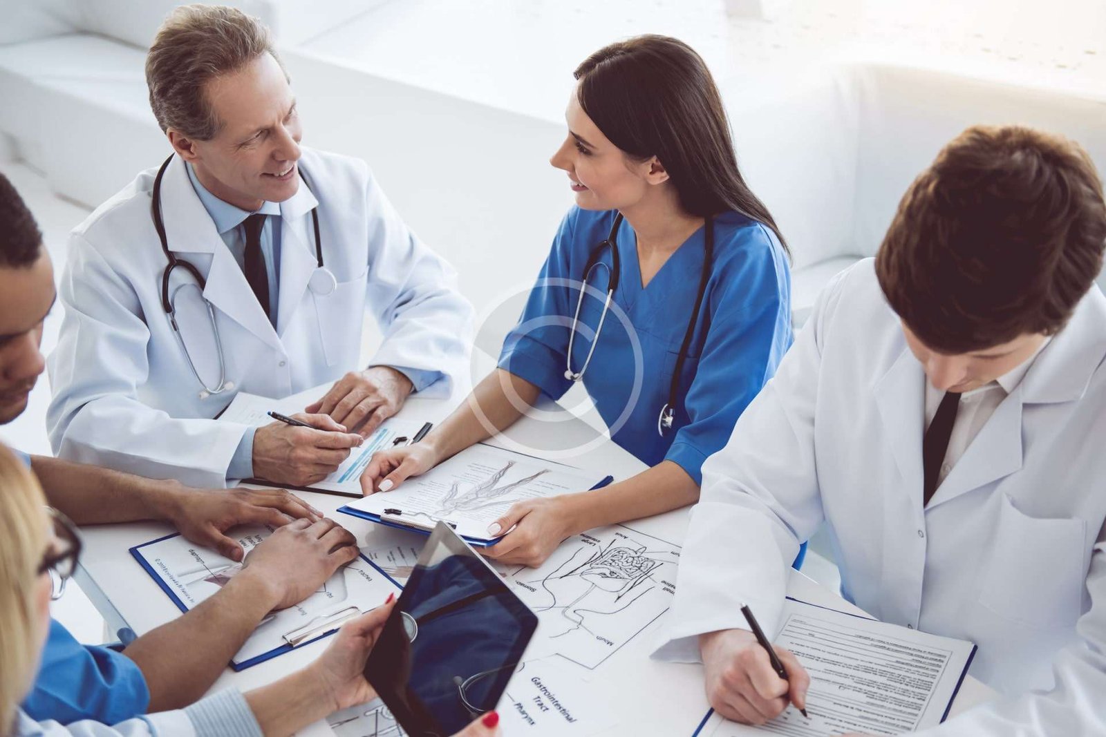 Medical professionals discussing and working together