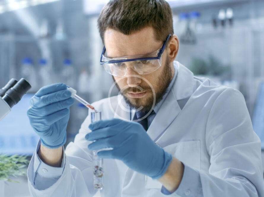 Medical scientist mixing liquids