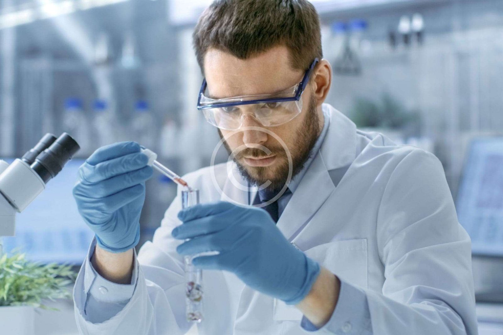 Medical scientist mixing liquids