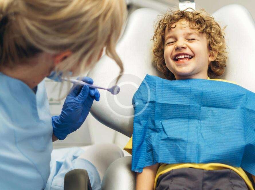 Boy receiving dental care from a dentist