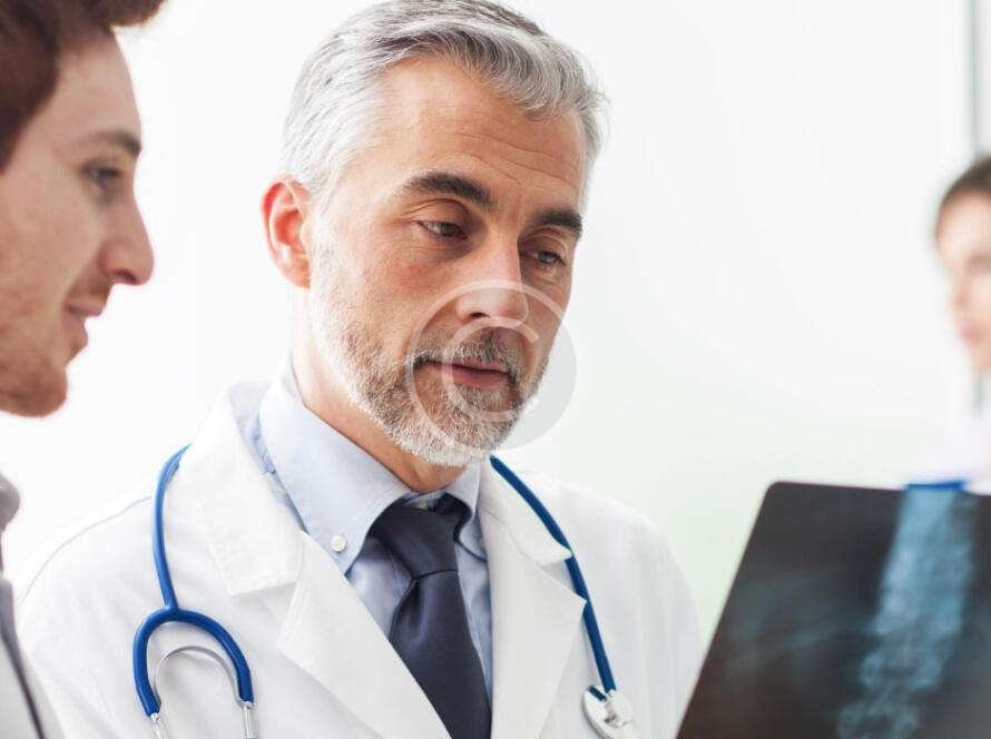 Doctors analyzing X-ray images