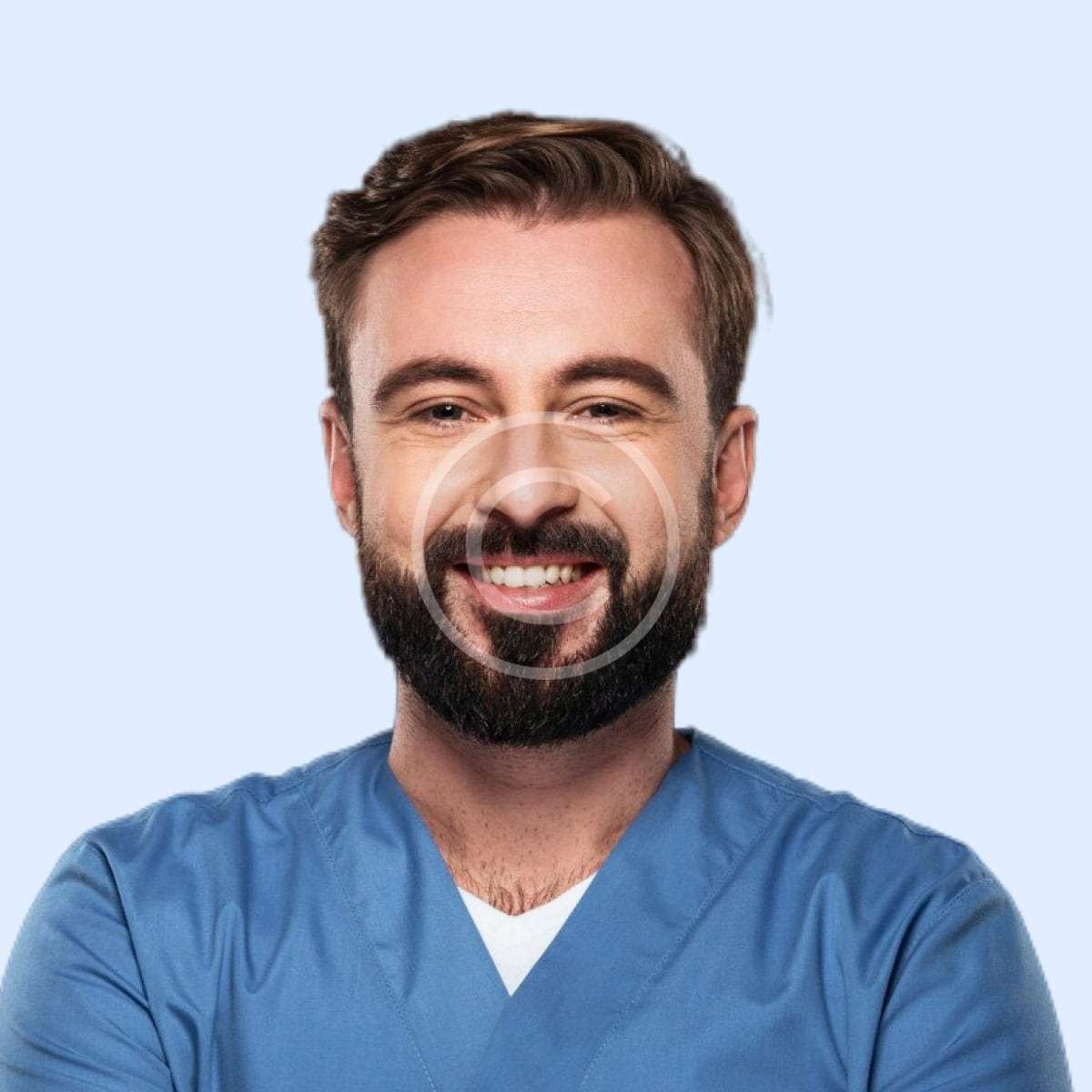 Smiling male doctor with blue shirt