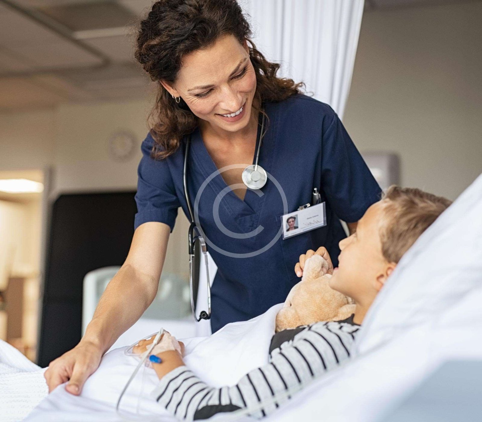 Female doctor attending to a young boy patient