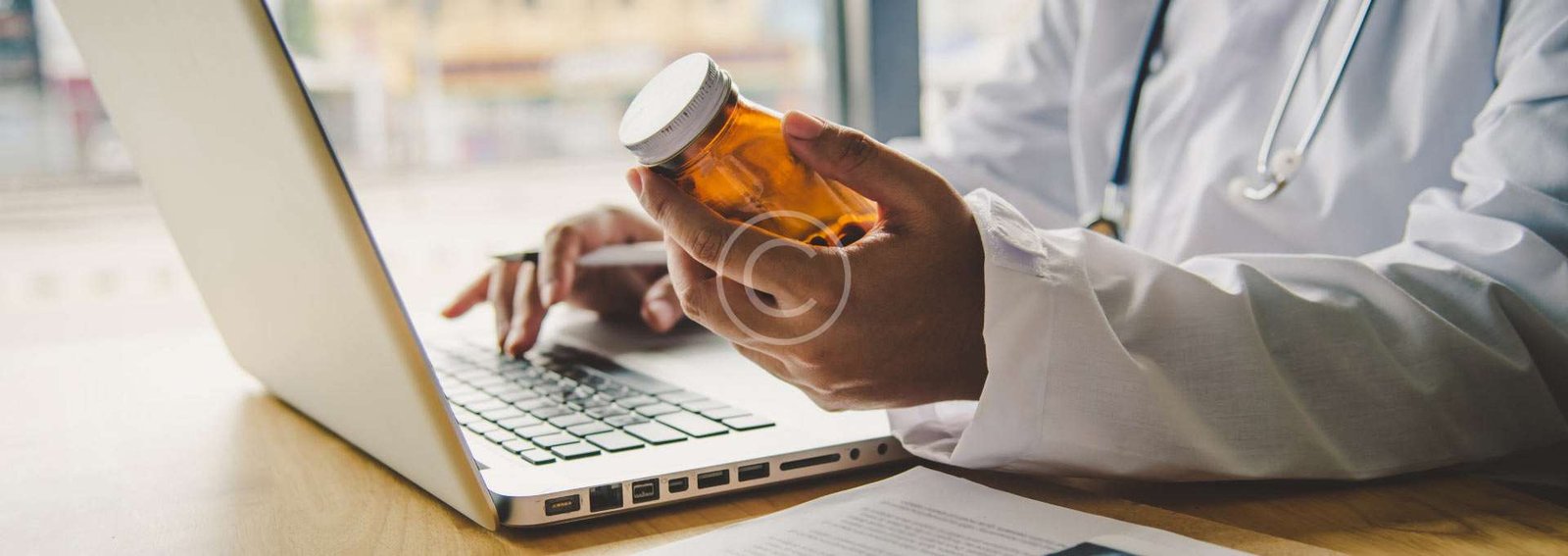 medical professional holding an empty bottle