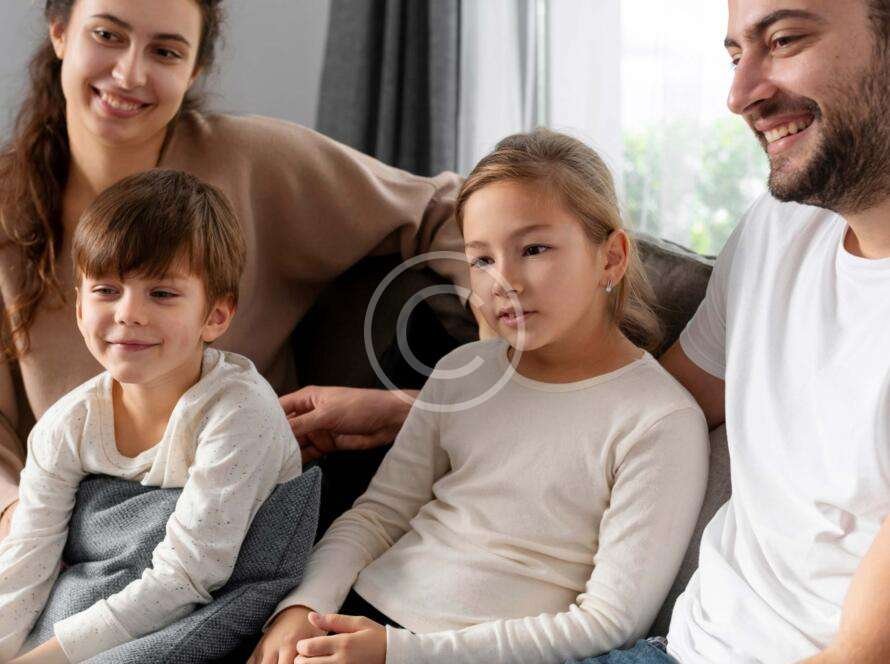 Family sitting on a couch together