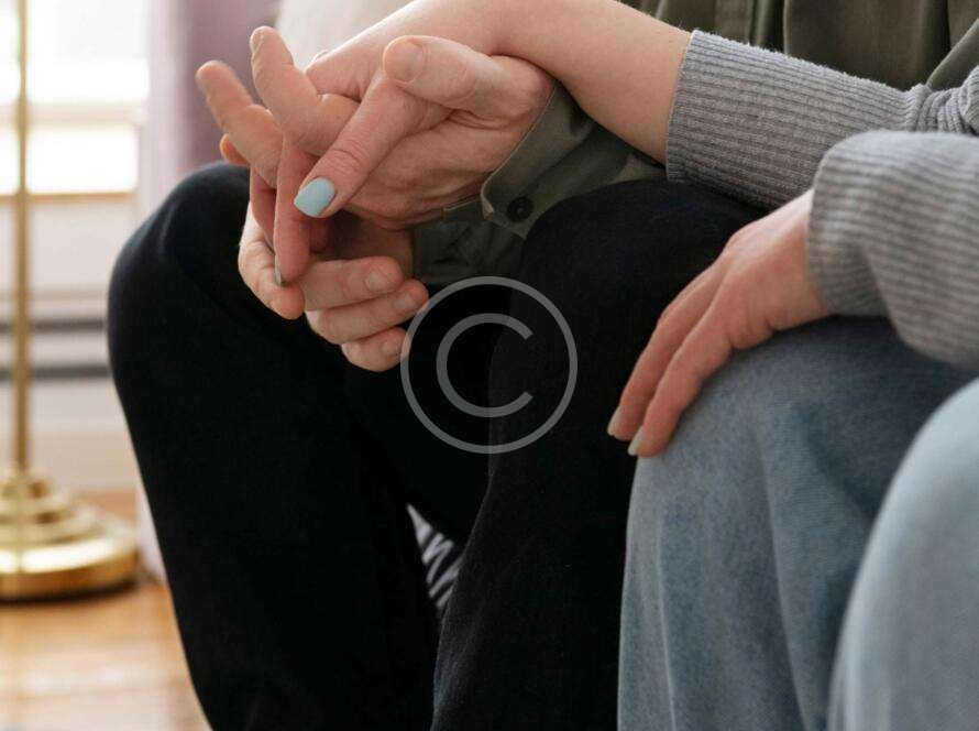 Two people holding hands