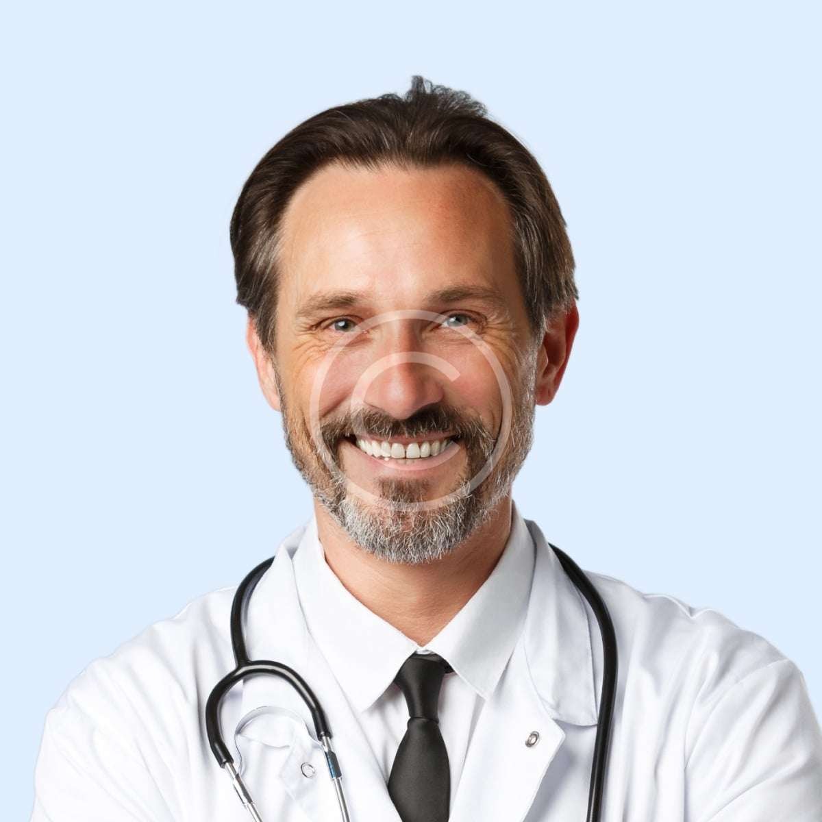 Smiling male doctor with white shirt and white lab-coat