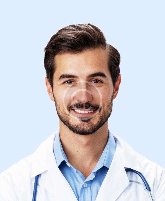 Smiling male doctor with blue shirt and white lab-coat