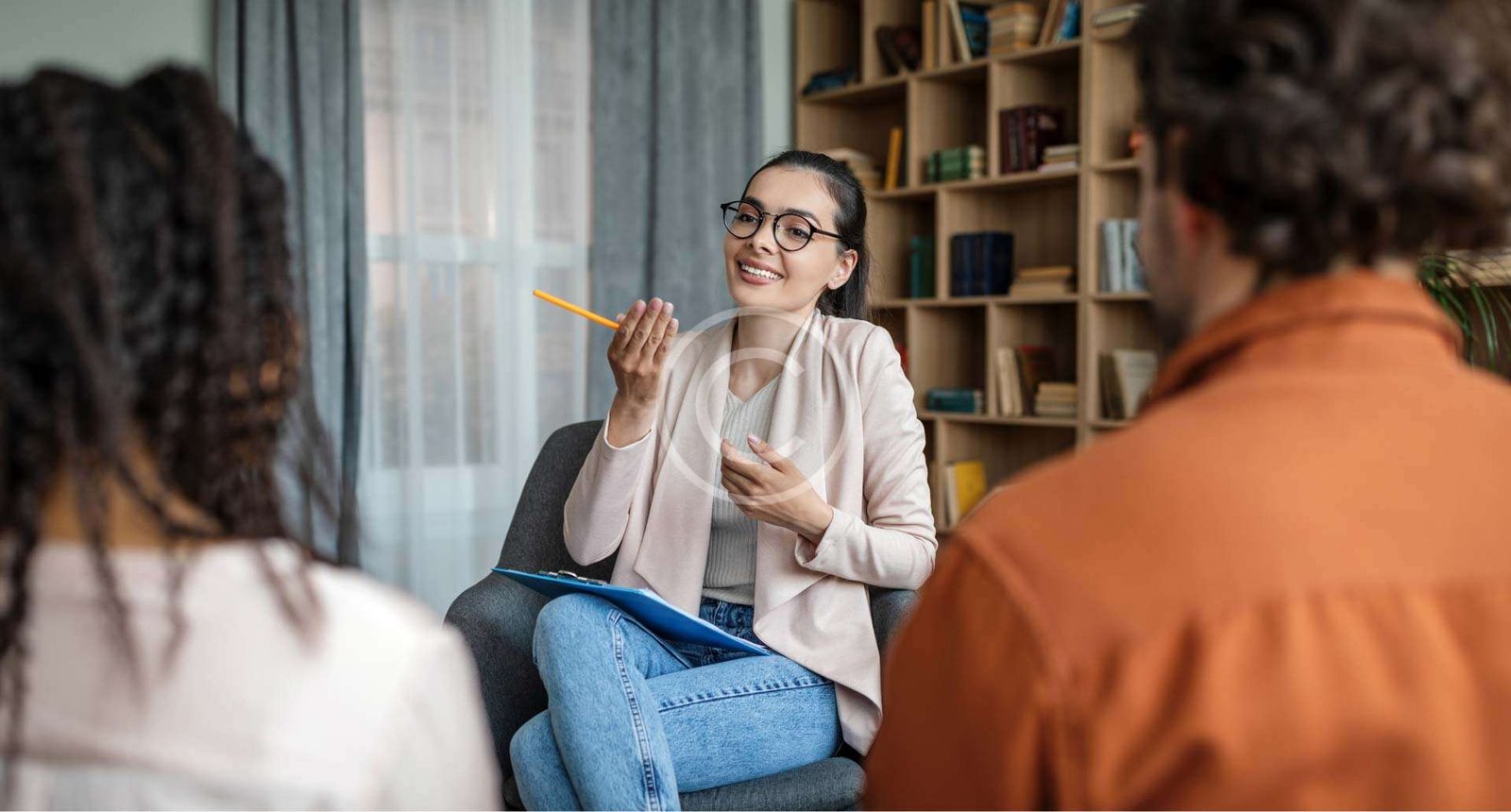 Woman explaining something to two people"