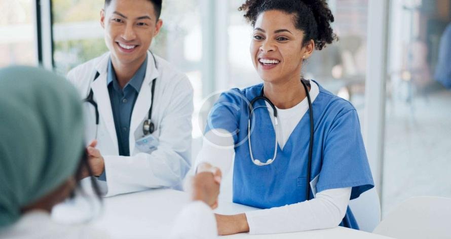 Doctors discussing and shaking hands