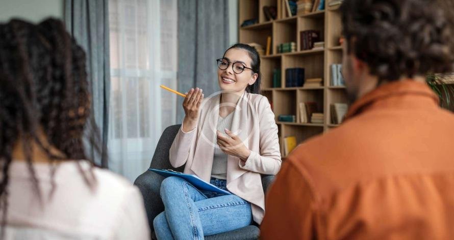 Woman explaining something to two people"